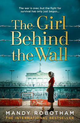 The Girl Behind The Wall - Readers Warehouse